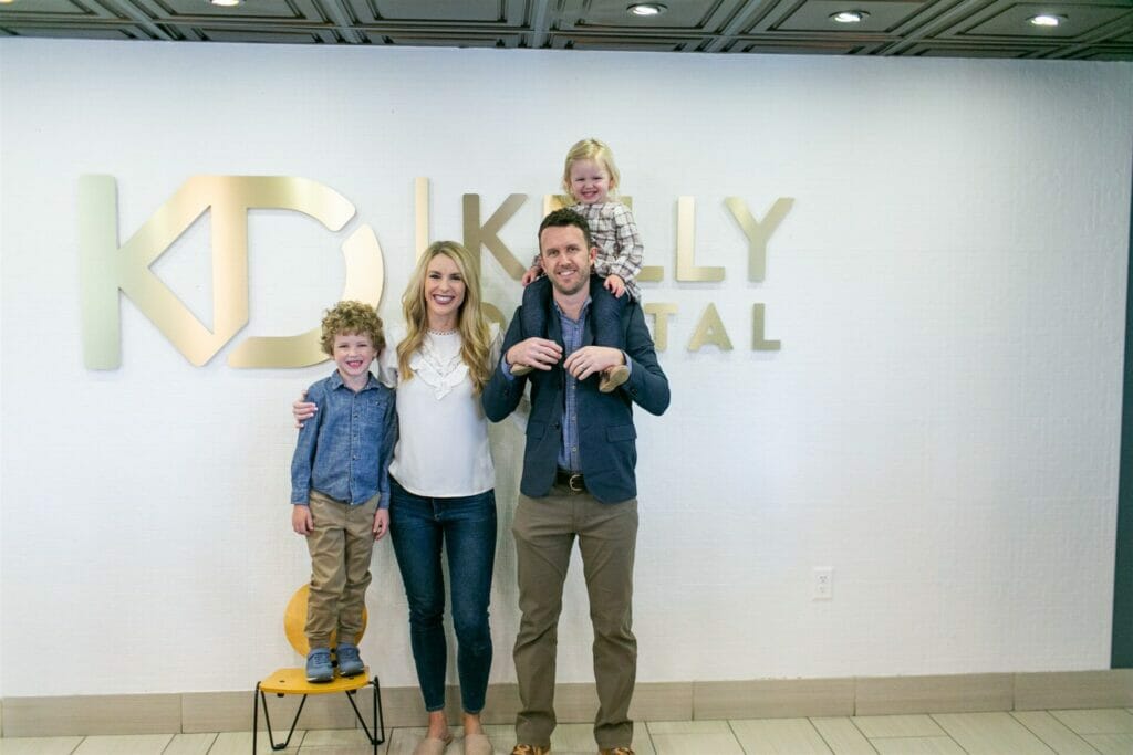 dr chase kelly with his family members in his dentistry